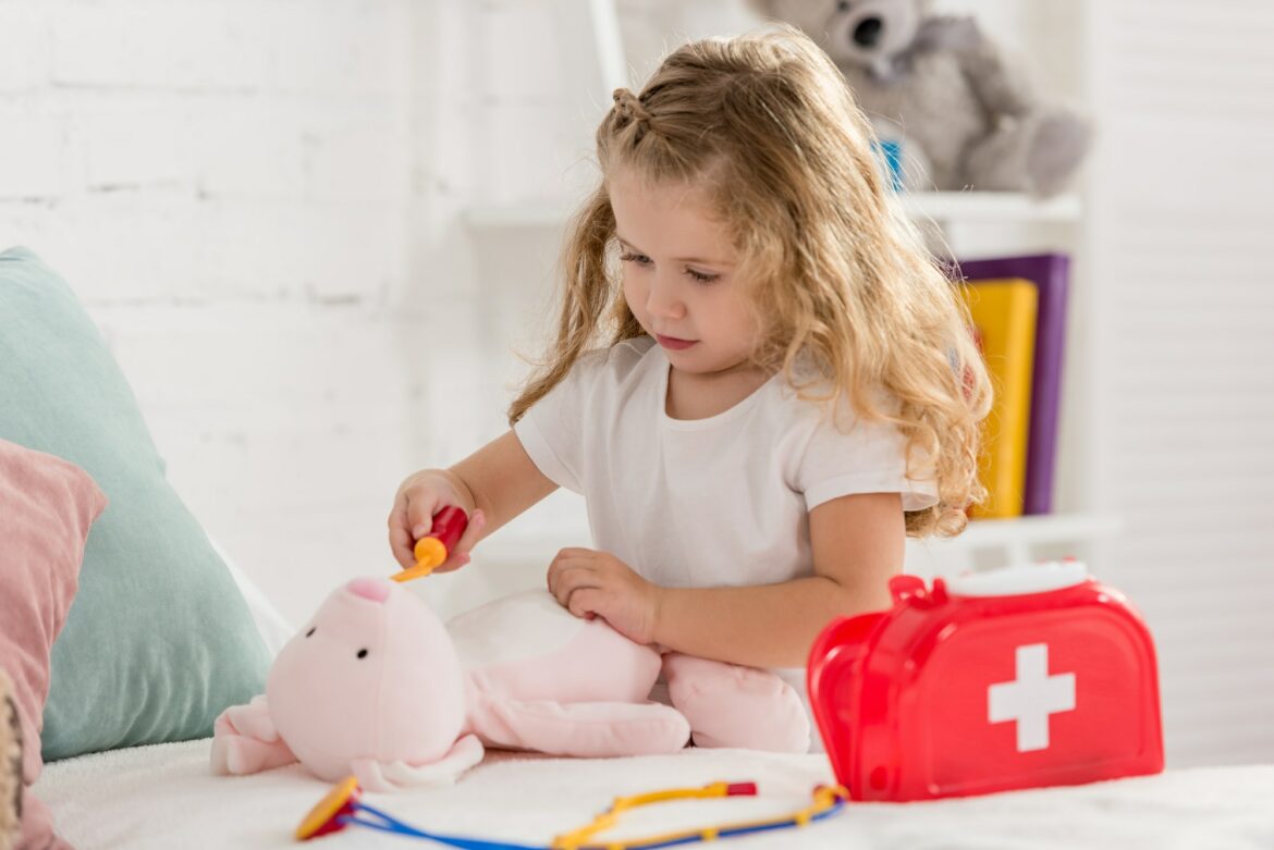 adorable-kid-examining-rabbit-toy-in-children-room.jpg