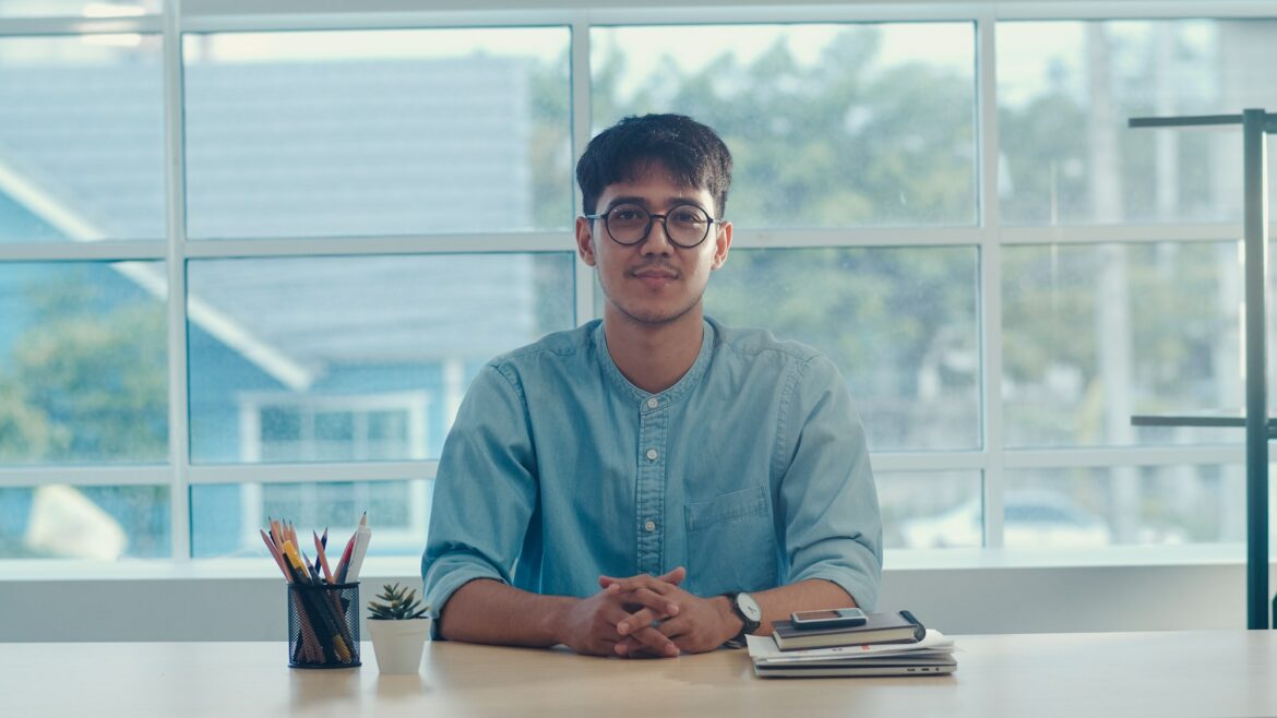 business-male-happy-relax-after-work-looking-to-camera-business-situation-in-modern-workplace-.jpg