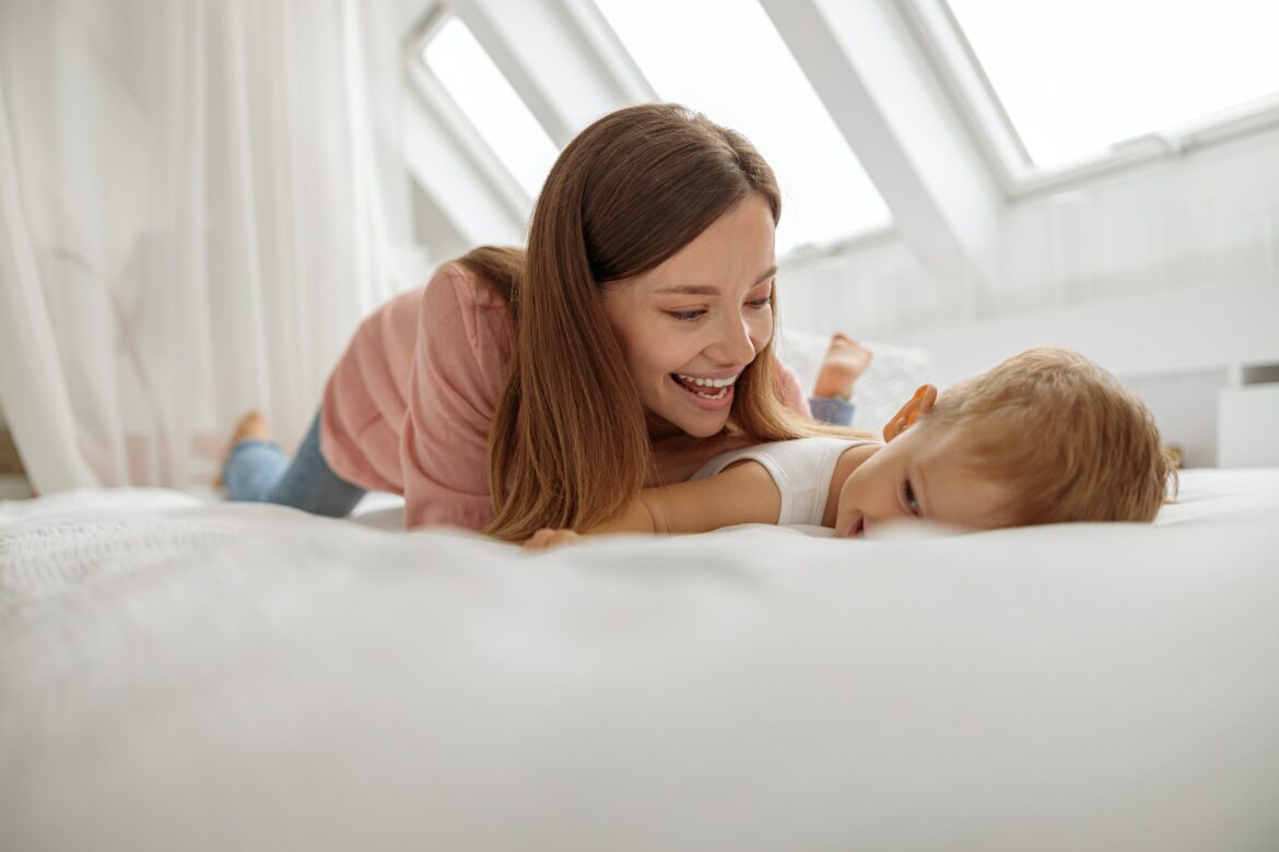 cute-kid-and-young-mom-enjoying-sunny-morning.jpg