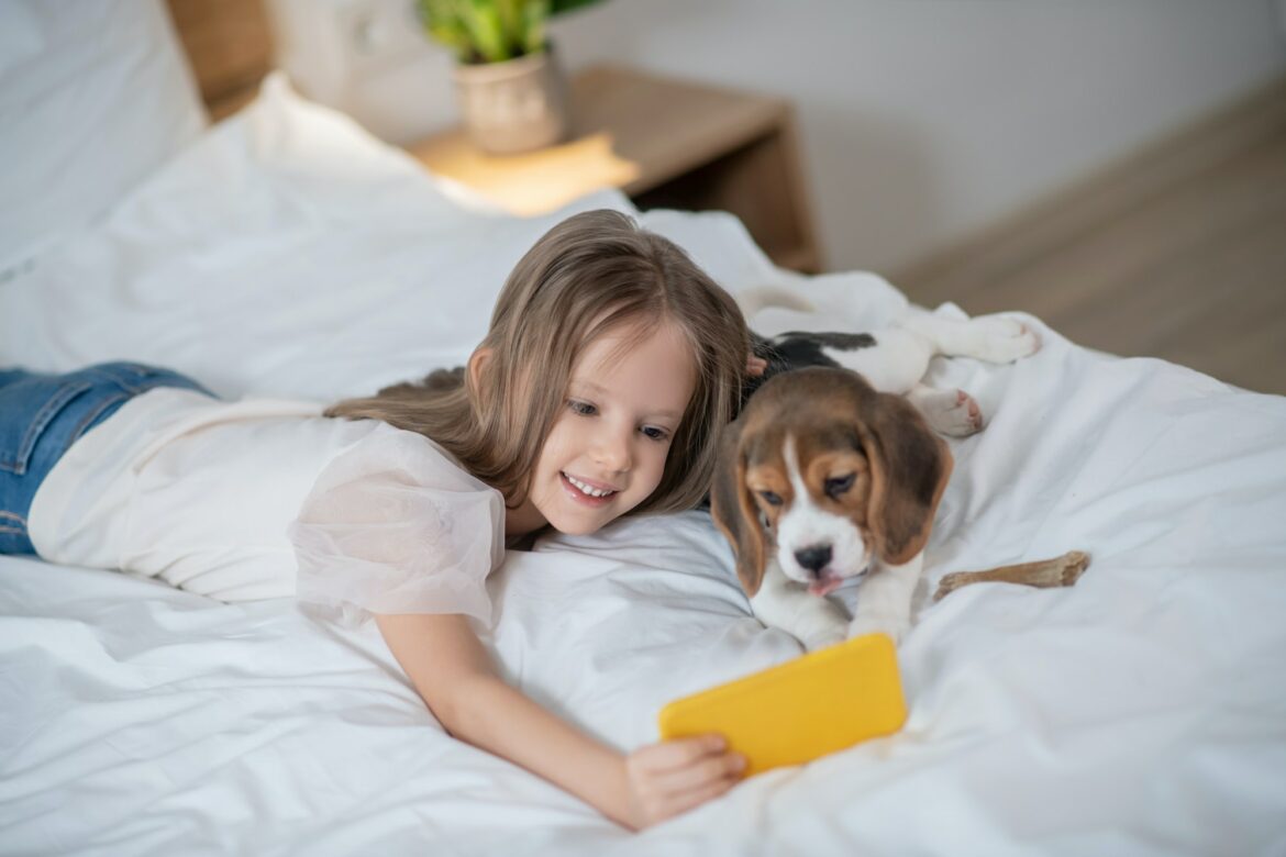 female-child-taking-selfies-with-her-dog.jpg