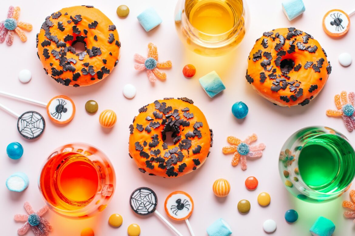 halloween-candy-on-pink-table-top-view-kids-party-table-concept.jpg