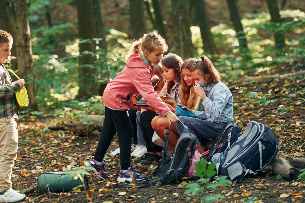 kids-in-green-forest-at-summer-daytime-together.jpg