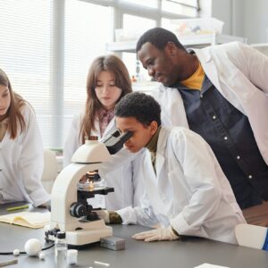 Kids using Microscope in Science Lab