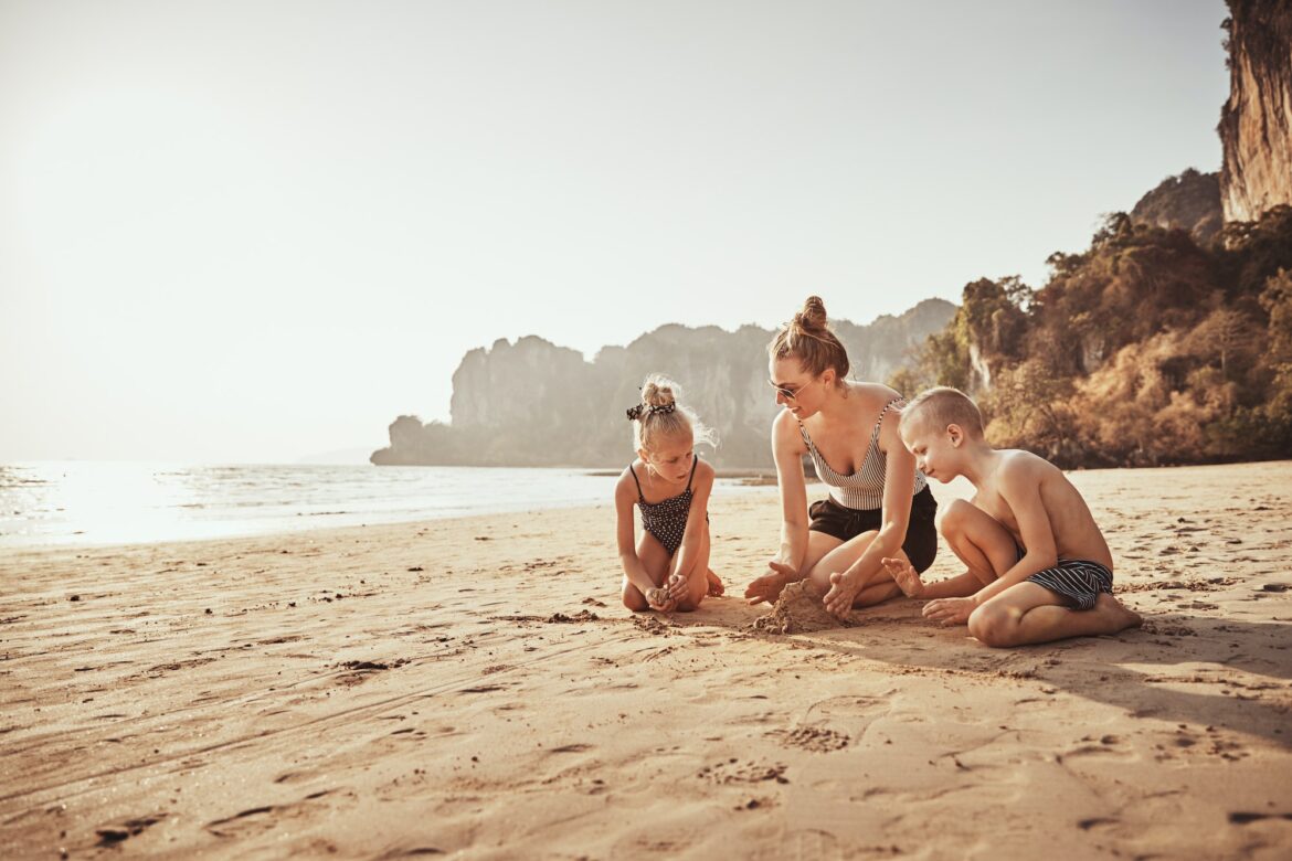 mother-and-kids-playing-in-the-sand-at-the-beach.jpg