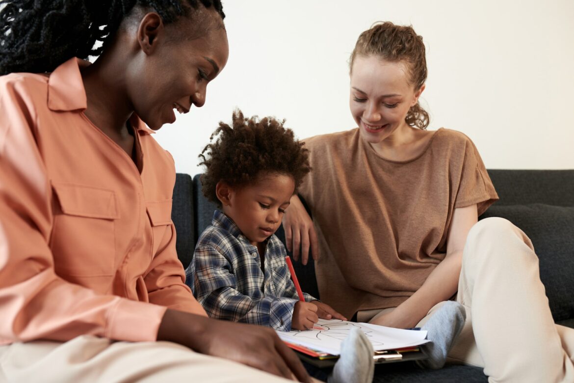 mothers-looking-at-kid-coloring-picture.jpg