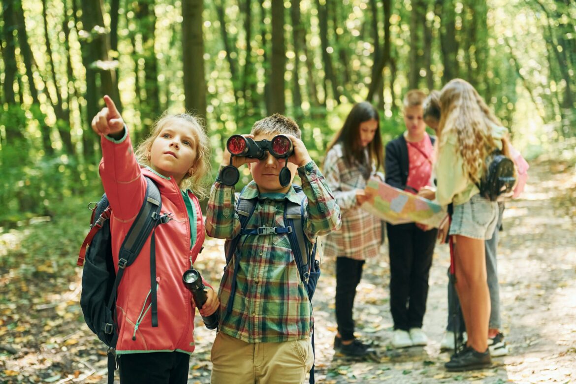 new-places-kids-in-green-forest-at-summer-daytime-together.jpg