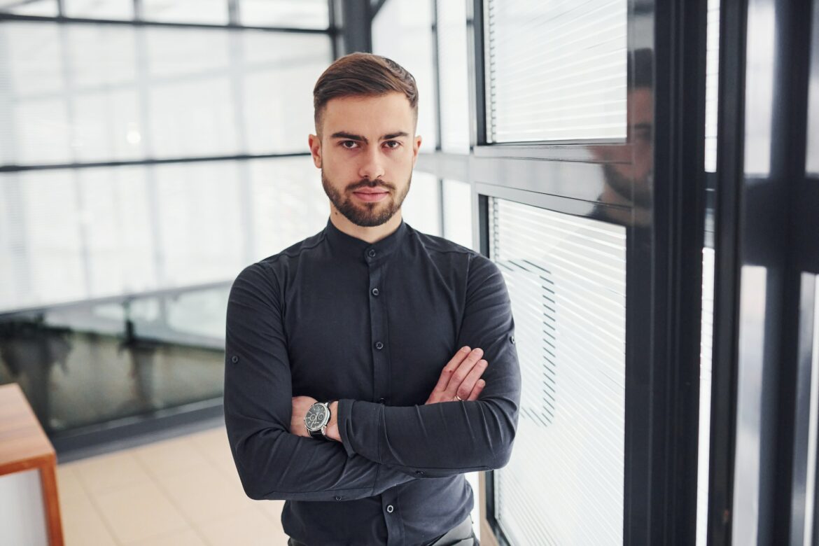 office-worker-in-formal-clothes-standing-indoors-at-daytime.jpg