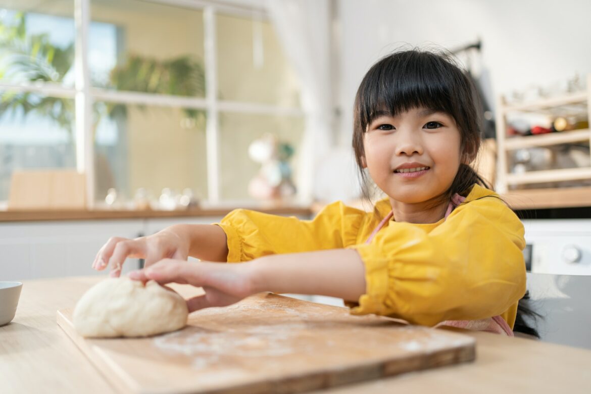 portrait-of-asian-young-kid-girl-doing-homemade-bakery-in-kitchen-.jpg