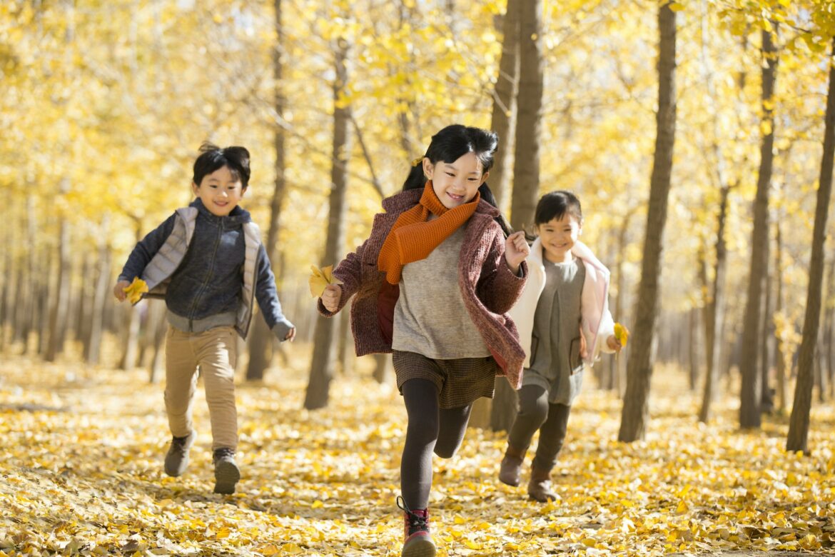 three-children-running-in-autumn-woods.jpg