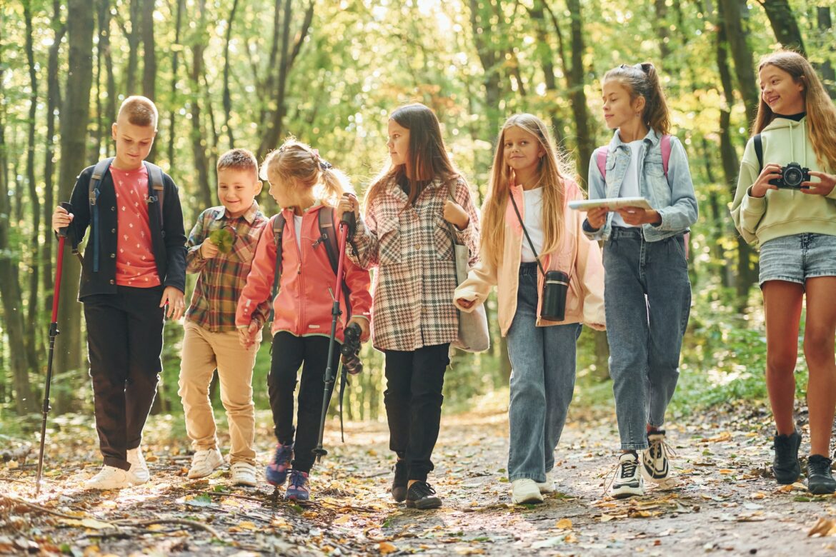 walking-together-kids-in-green-forest-at-summer-daytime-1.jpg