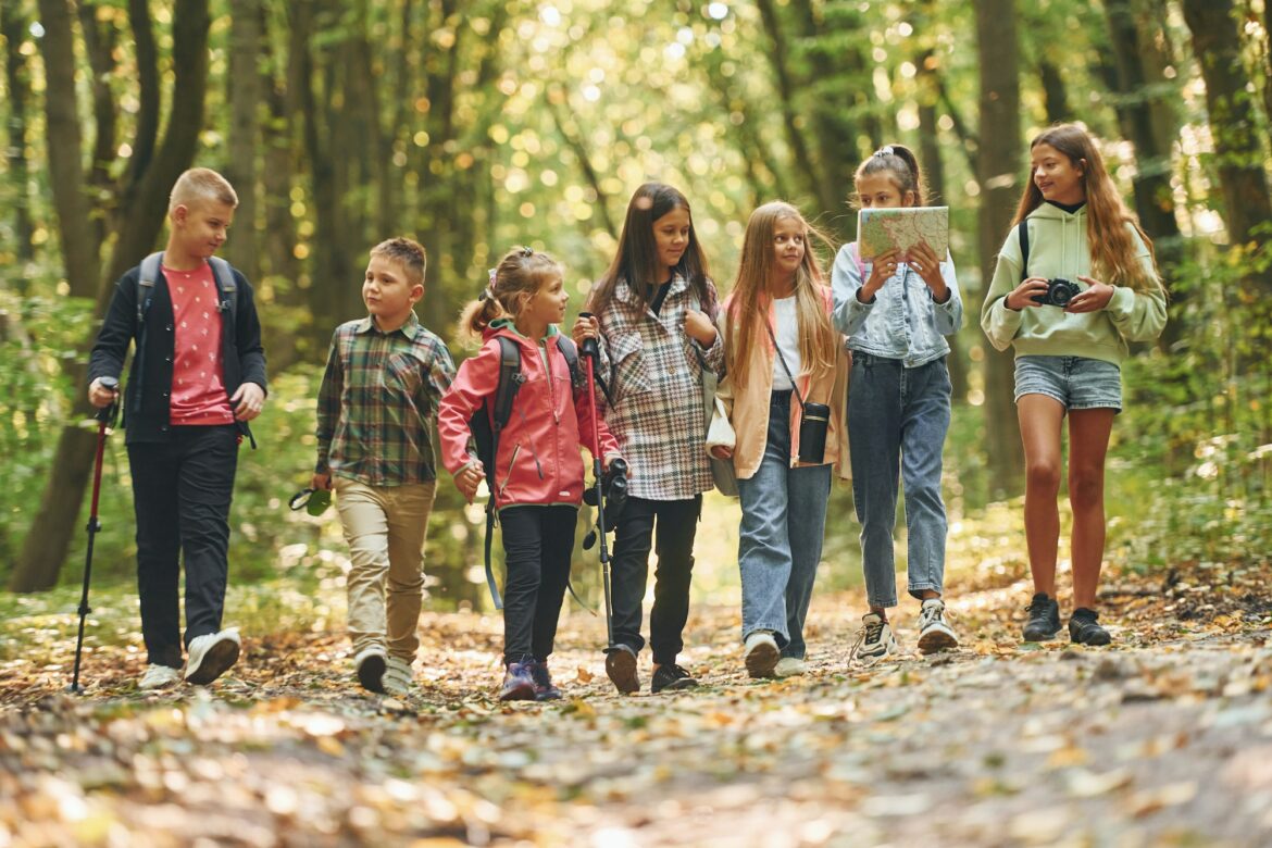 walking-together-kids-in-green-forest-at-summer-daytime.jpg