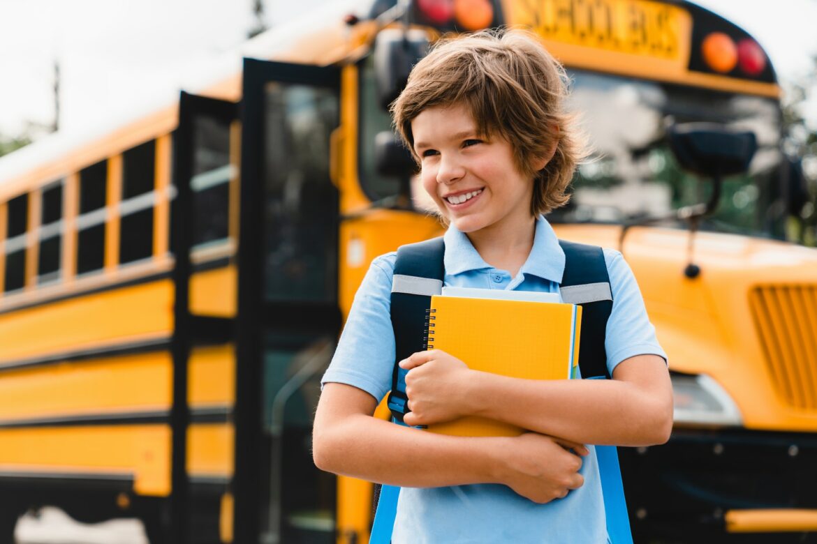 young-caucasian-schoolboy-kid-pupil-student-holding-copybooks-and-books-preparing-for-school.jpg